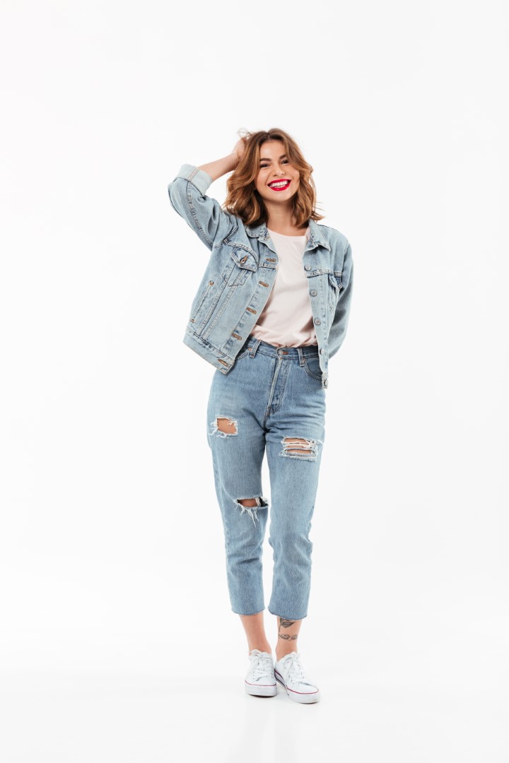 Full length image of Cheerful woman in denim clothes